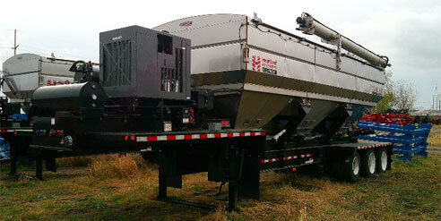 Red Tractor Spraying Field